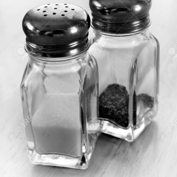 Detail of salt and pepper shakers on table top